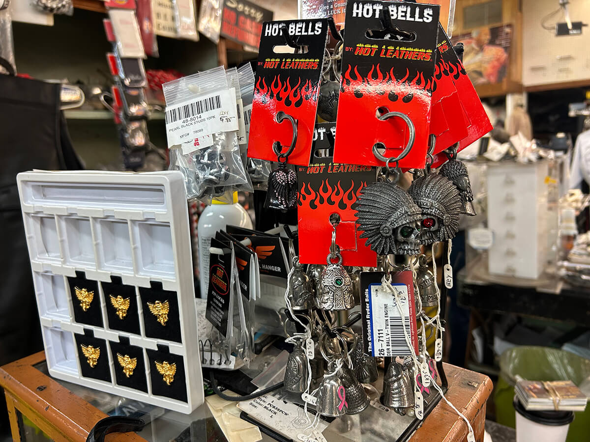 Hot Leathers ride bells, pins and biker accessories on a display at Kornfeld's.