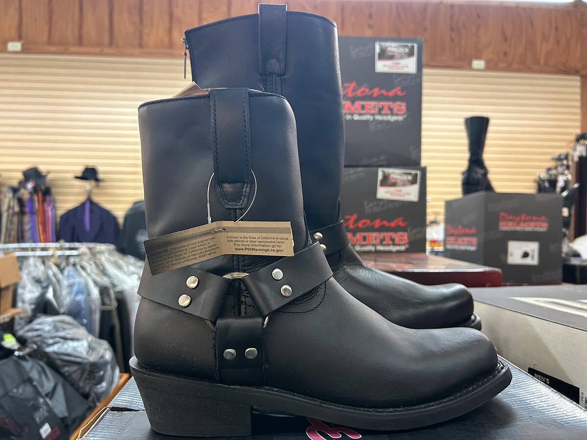 A pair of black leather harness motorcycle boots on display at Kornfeld's.