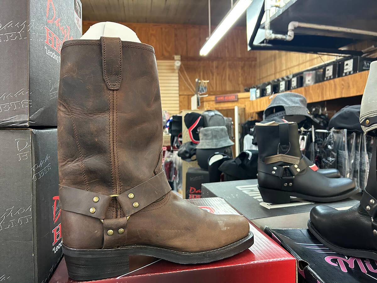 A brown leather harness motorcycle boot on display at Kornfeld's.